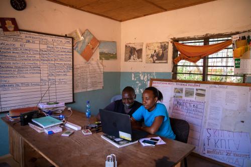 Florence Mramba at the office with Peter Komora