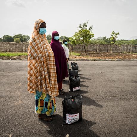 Women collecting Covid-19 relief packages