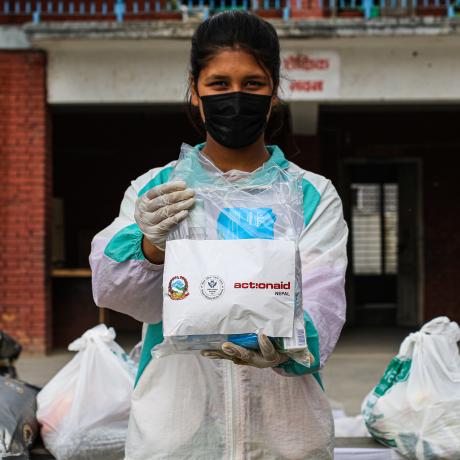 Monalisa, 16, volunteers during an ActionAid Nepal relief distribution, April 2020.